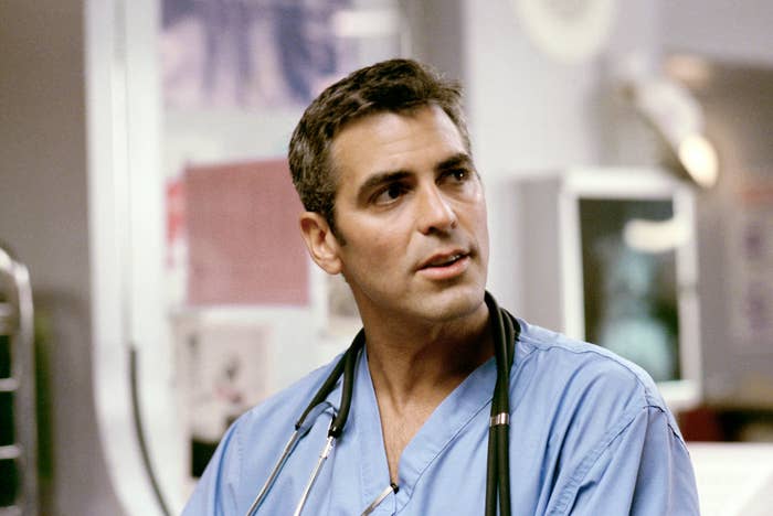 A man wearing light blue scrubs