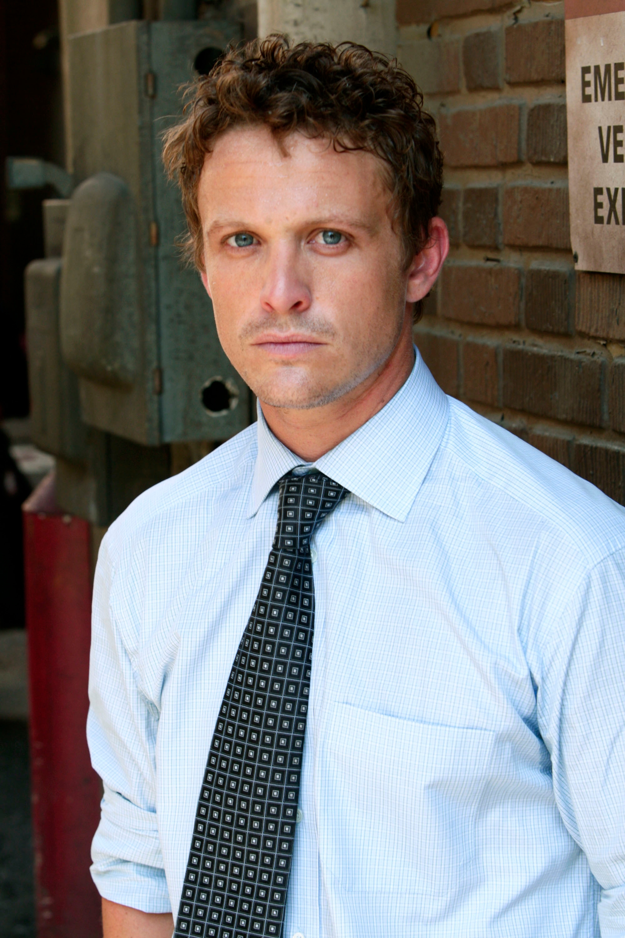 A man wearing a tie and button-up shirt