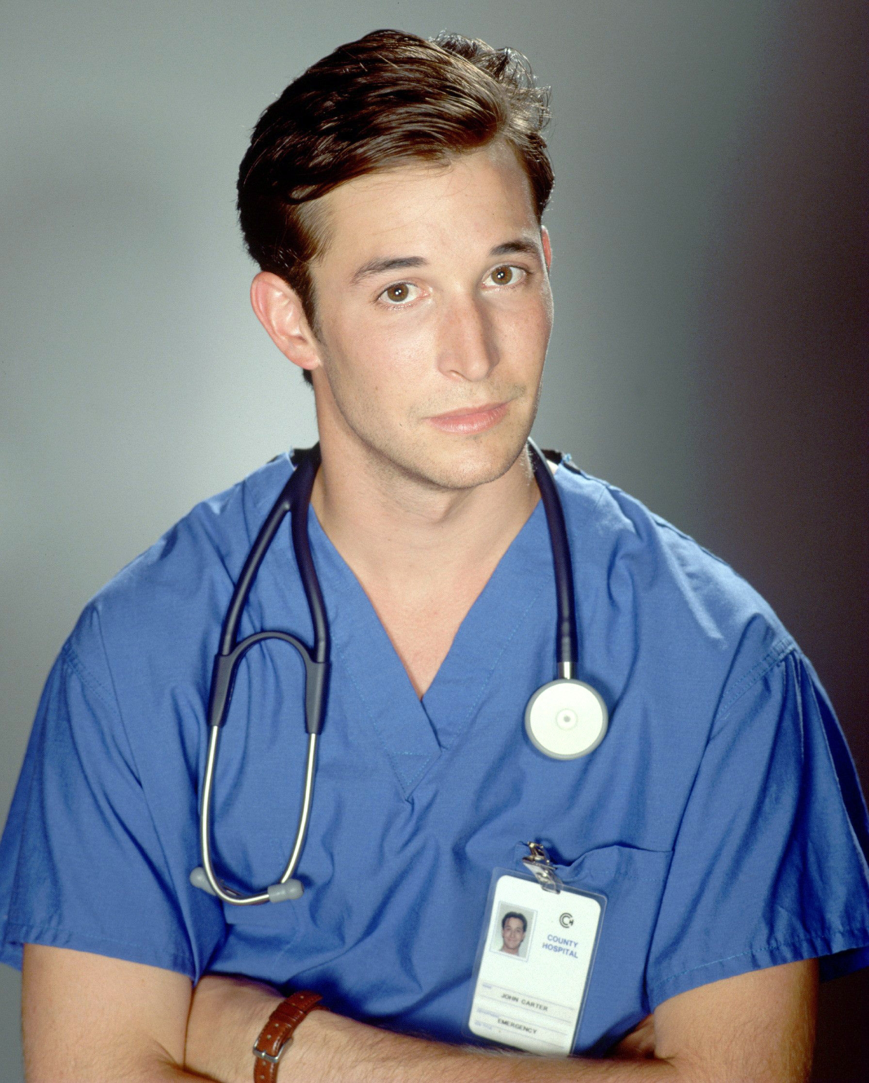 A man wearing blue scrubs