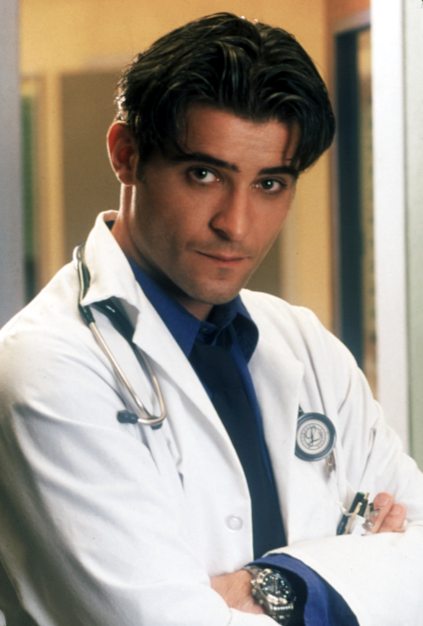 A man wearing a white lab coat