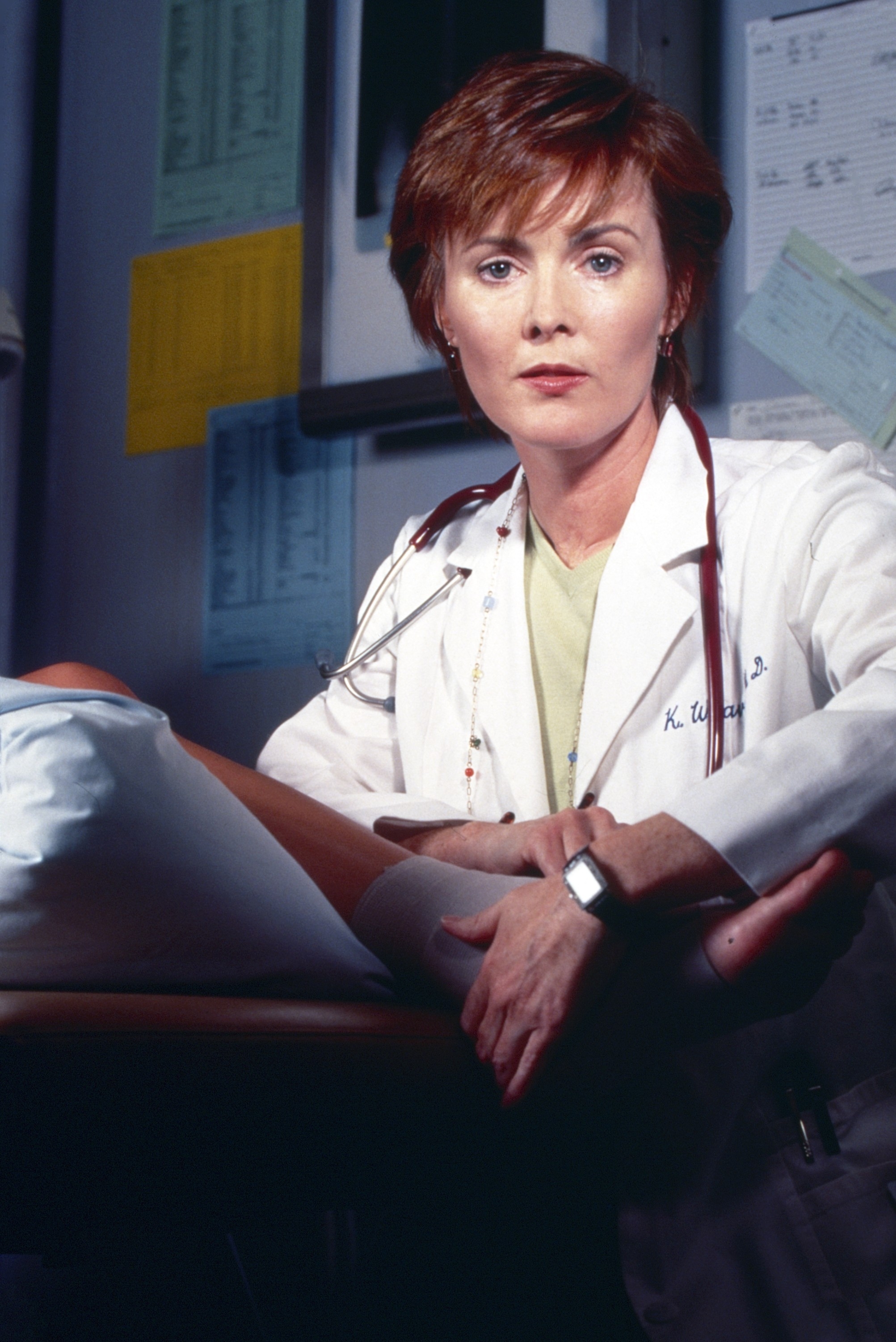 A woman wearing a white lab coat
