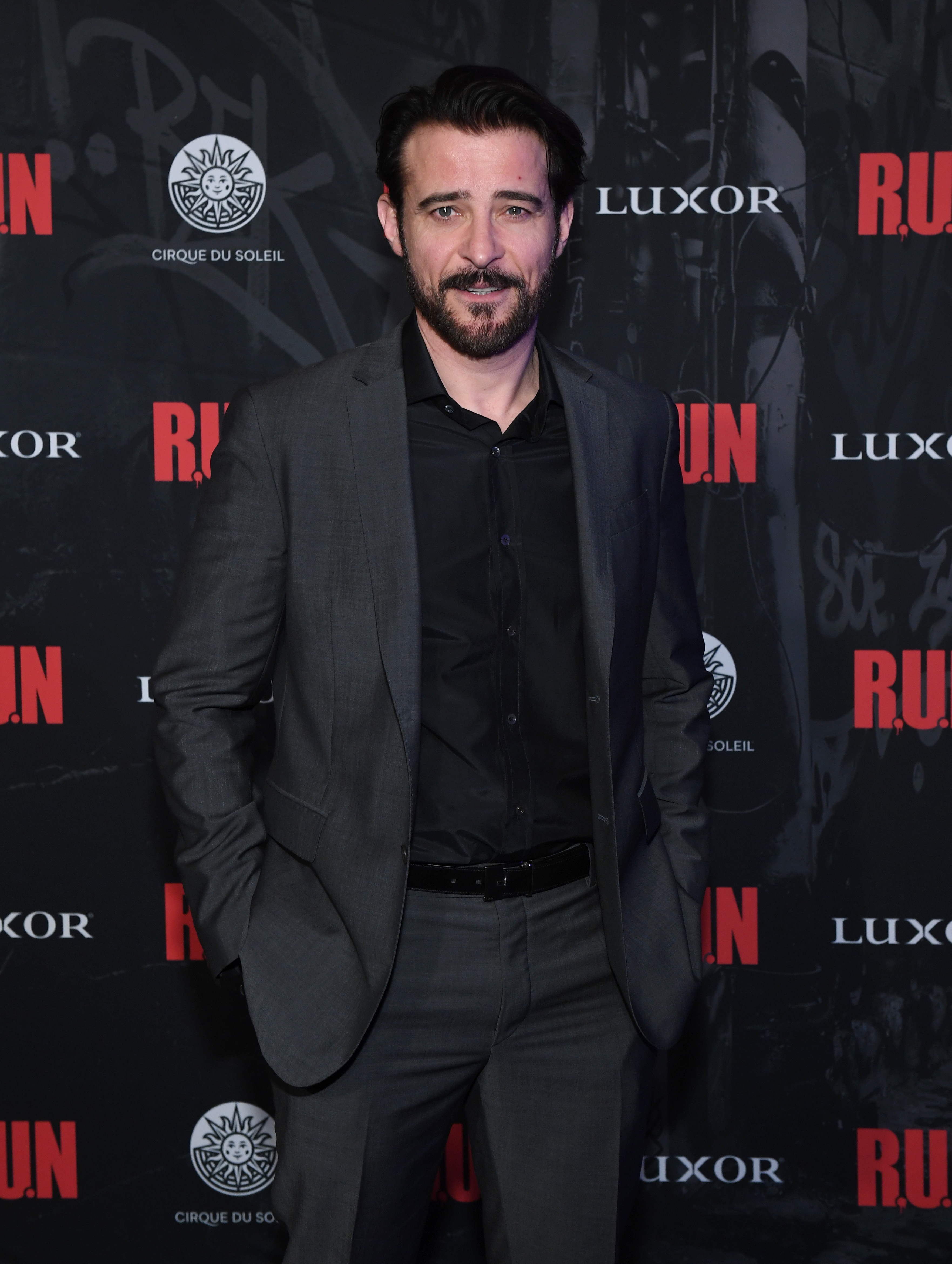 A man wearing a dark suit