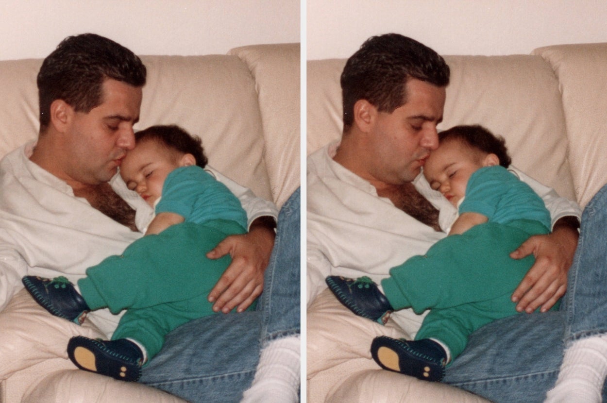 A man gently holds and cuddles a sleeping baby on a couch, creating a tender, heartwarming moment of bonding and affection