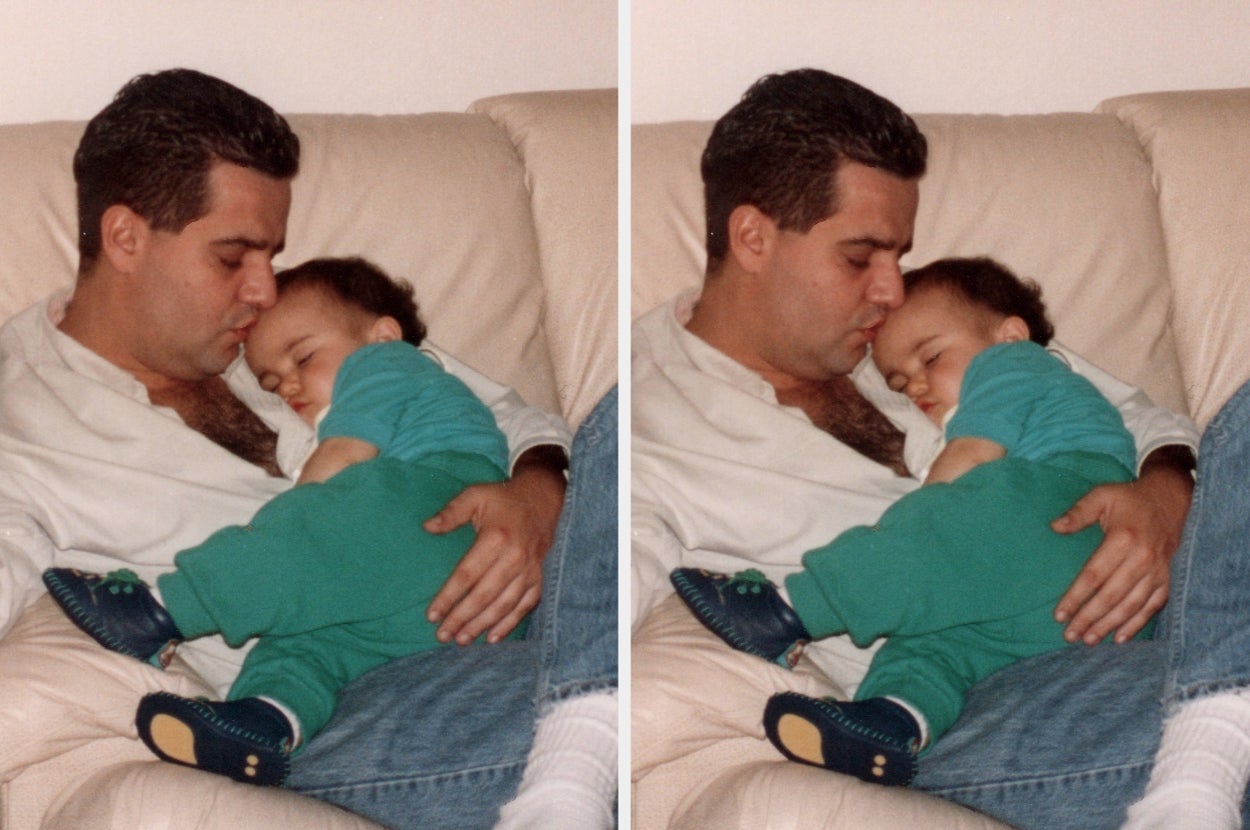 A man gently holds and cuddles a sleeping baby on a couch, creating a tender, heartwarming moment of bonding and affection