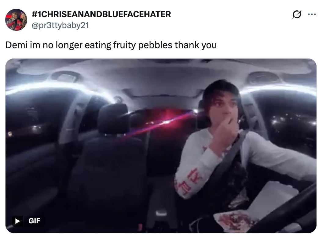 Person driving and eating cereal at night, with tweet above reading: "Demi im no longer eating fruity pebbles thank you."