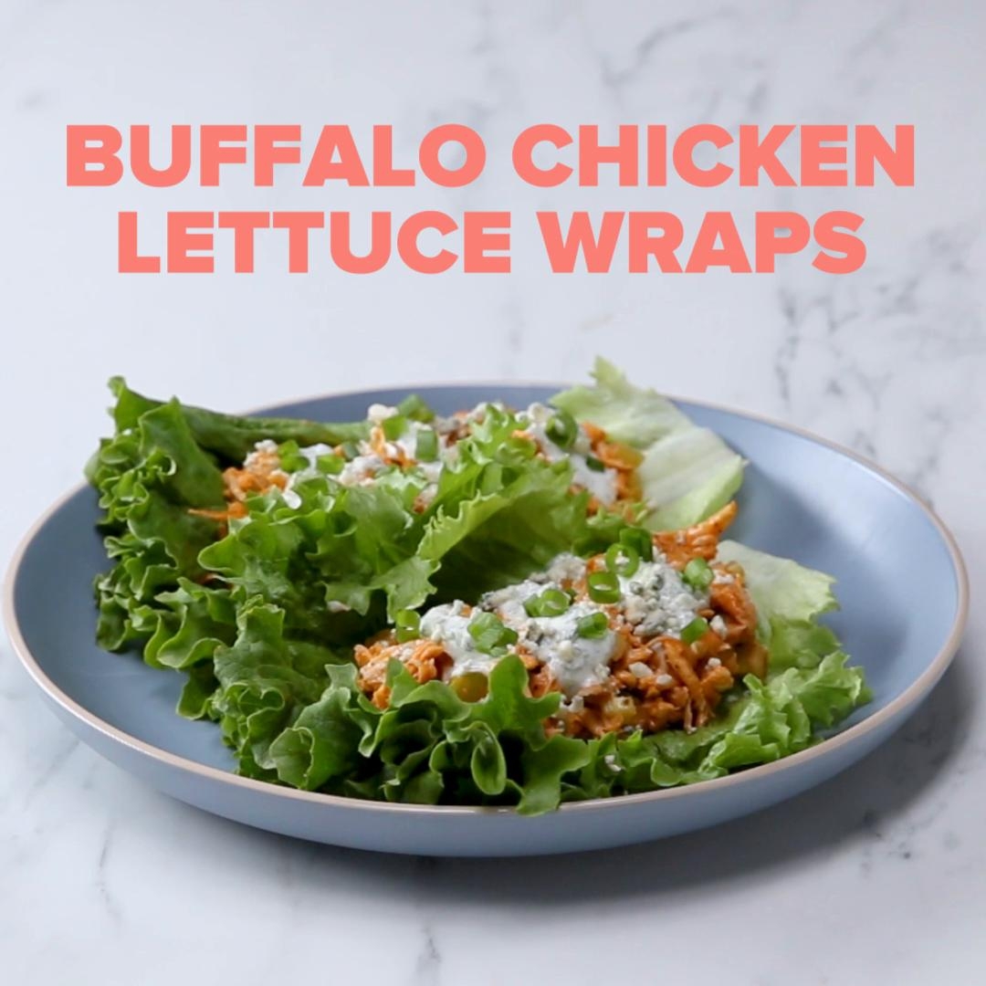 Buffalo chicken lettuce wraps served on a plate, topped with a creamy sauce, with text stating "Buffalo Chicken Lettuce Wraps."
