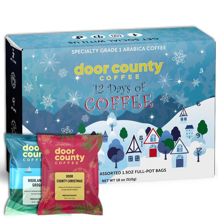 Box of Door County Coffee's "12 Days of Coffee" with winter-themed design, showing two coffee bag varieties: Highlander Grogg and Door County Christmas