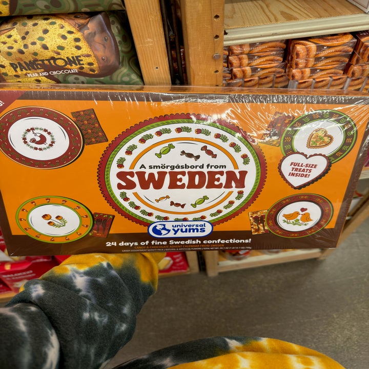Box labeled "A smörgåsbord from Sweden" with graphics of plates and treats seen in a store display; includes 24 days of Swedish confections