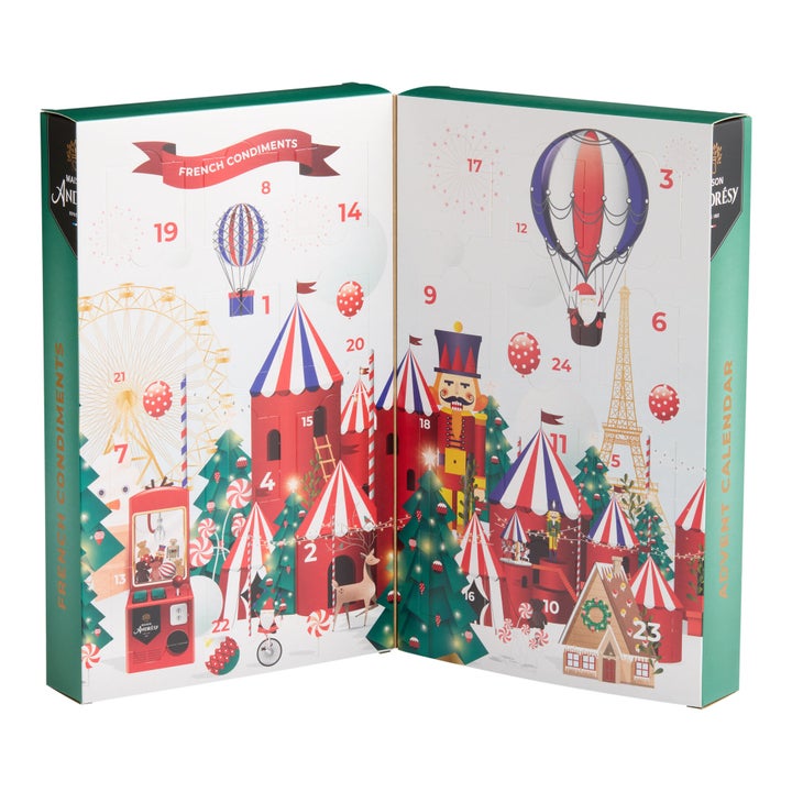Advent calendar with illustrated festive scenes, featuring number windows for each day of December