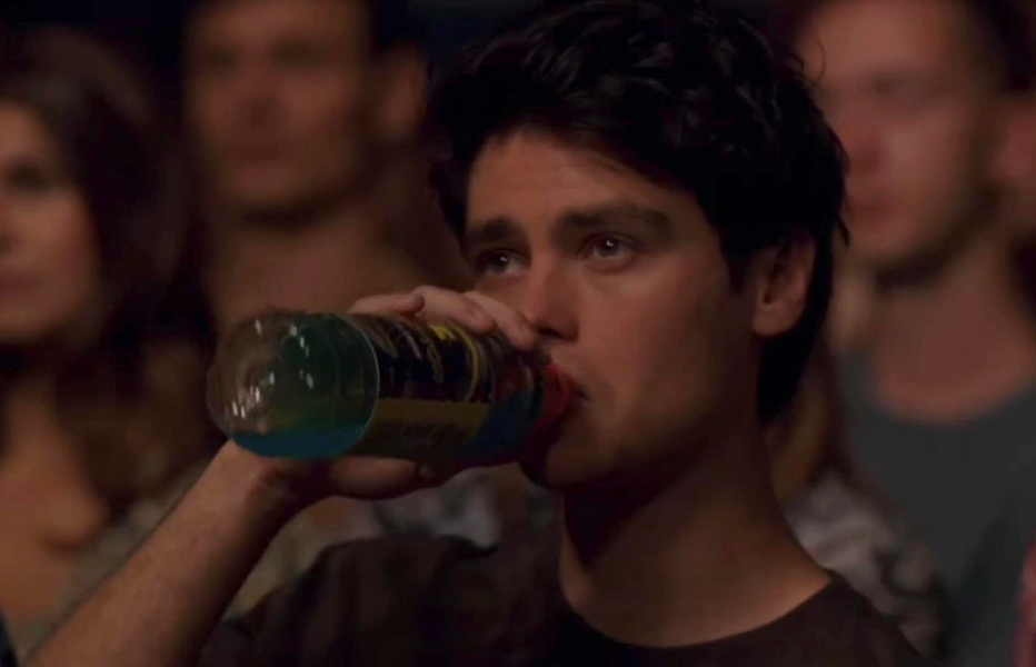 Marcus drinks intoxicant from a vessel astatine the schoolhouse play