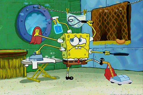 SpongeBob SquarePants multitasks humorously, ironing, cleaning, and vacuuming