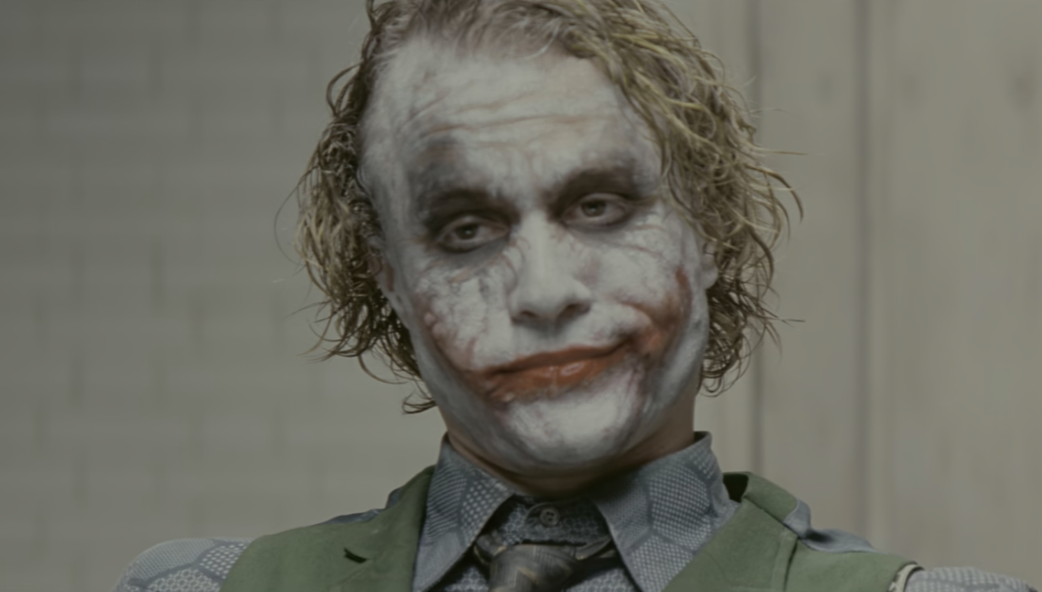 A quality  dressed arsenic  a sinister clown with smeared constitution  has a knowing expression, wearing a vest and patterned shirt