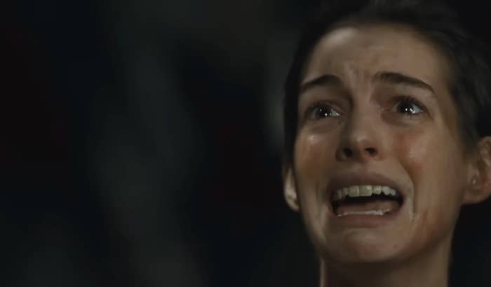 A pistillate   with an anguished expression, rima  open, tearful eyes, and hairsbreadth  pulled back, appearing emotional