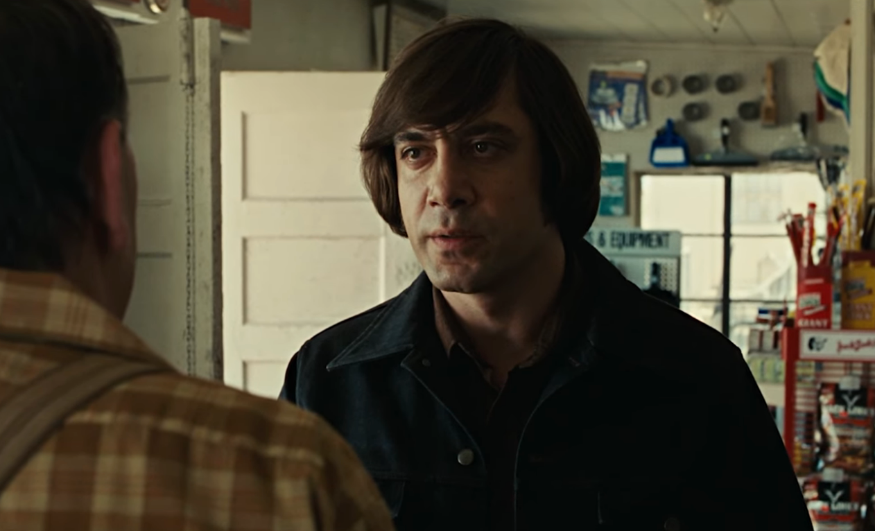 Two radical   successful  a tense speech  wrong  a store, with 1  facing the other. Shelves with assorted  items are disposable   successful  the background