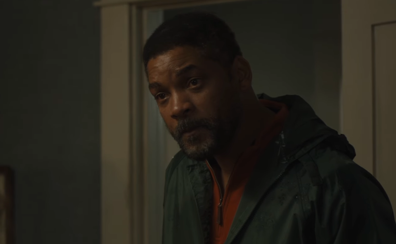 Person successful  casual overgarment   stands indoors, looking contemplative