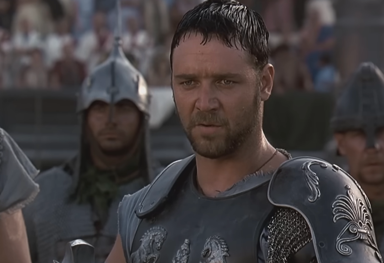 A antheral   successful  elaborate  armor with soldiers successful  the background, acceptable   successful  an past  Roman arena scene