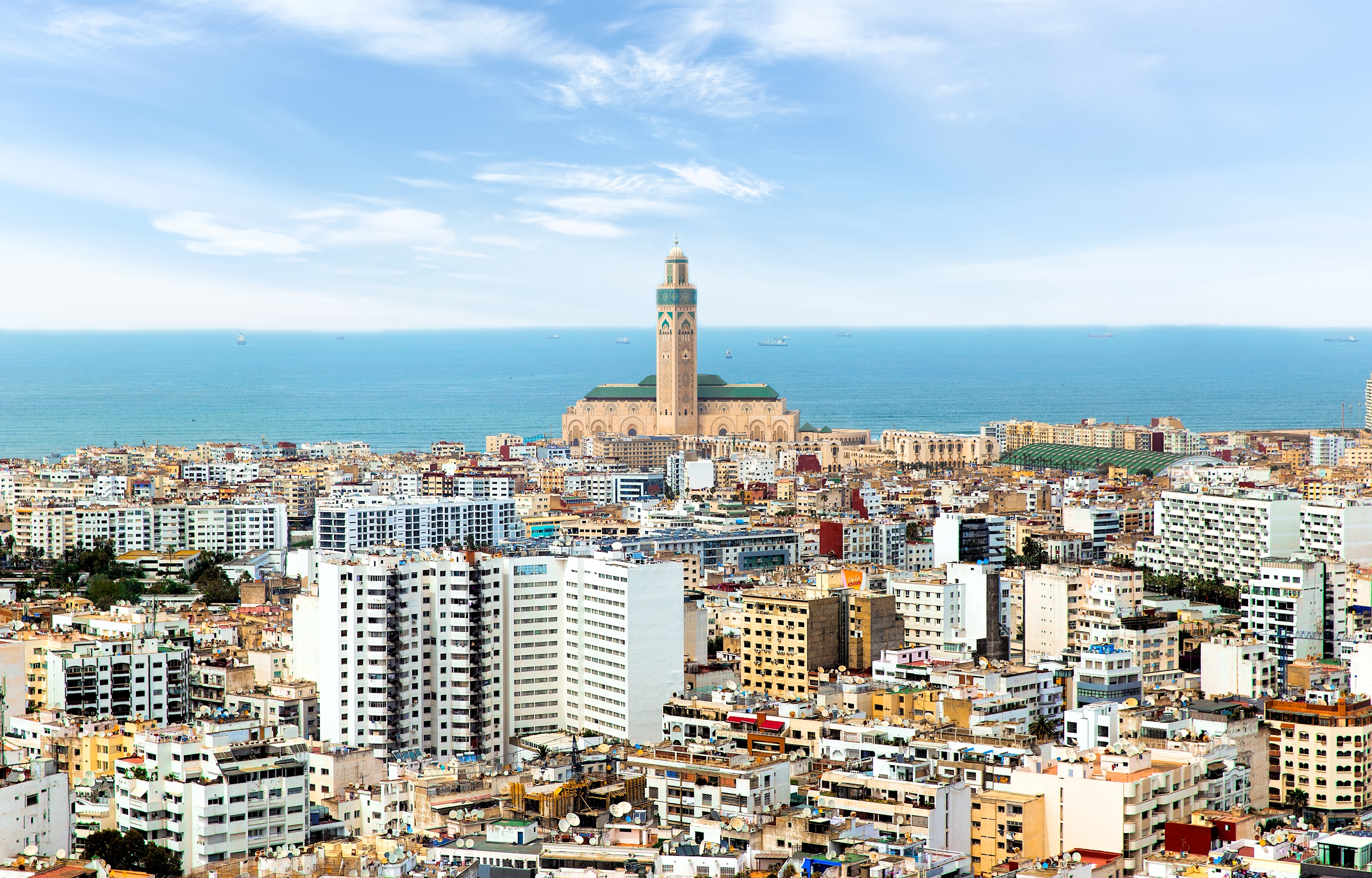 Aerial presumption of Casablanca with the Hassan II Mosque by the coast, surrounded by a premix of modern and accepted buildings