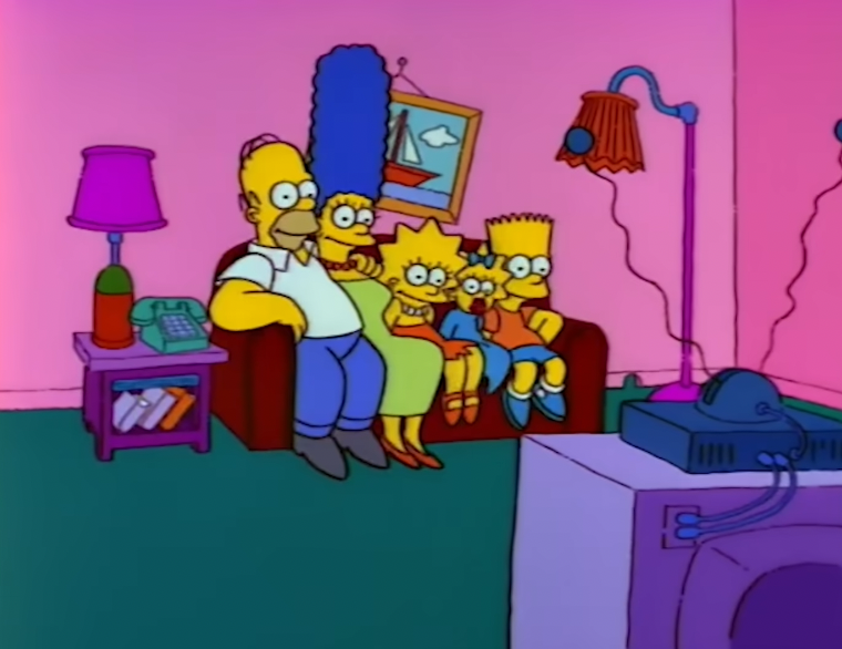 The Simpsons household  sits connected  a sofa  successful  their surviving  room, watching TV together