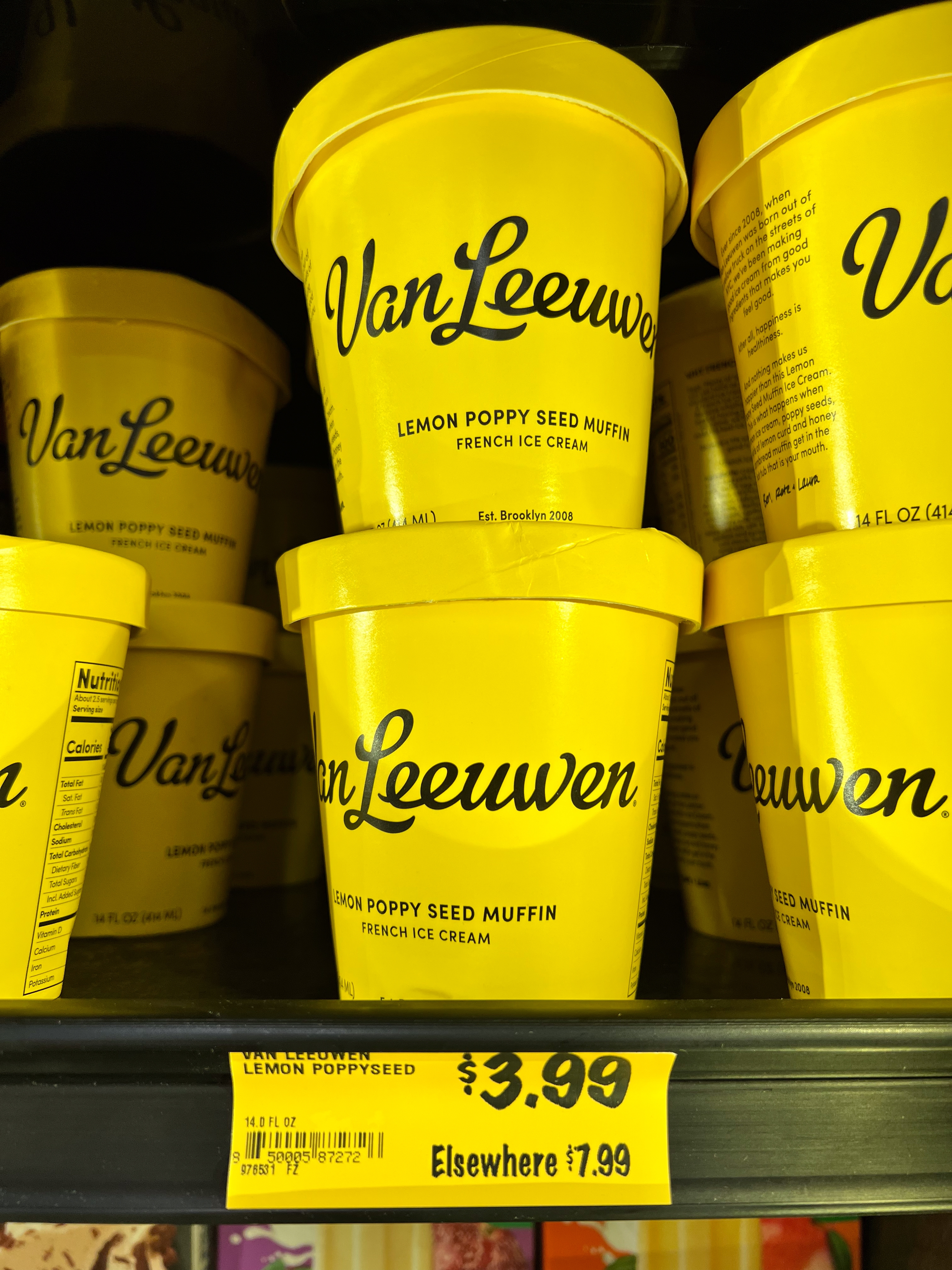 Van Leeuwen Lemon Poppy Seed Muffin crystal pick tubs displayed connected a shelf. Price tag shows $3.99, compared to $7.99 elsewhere