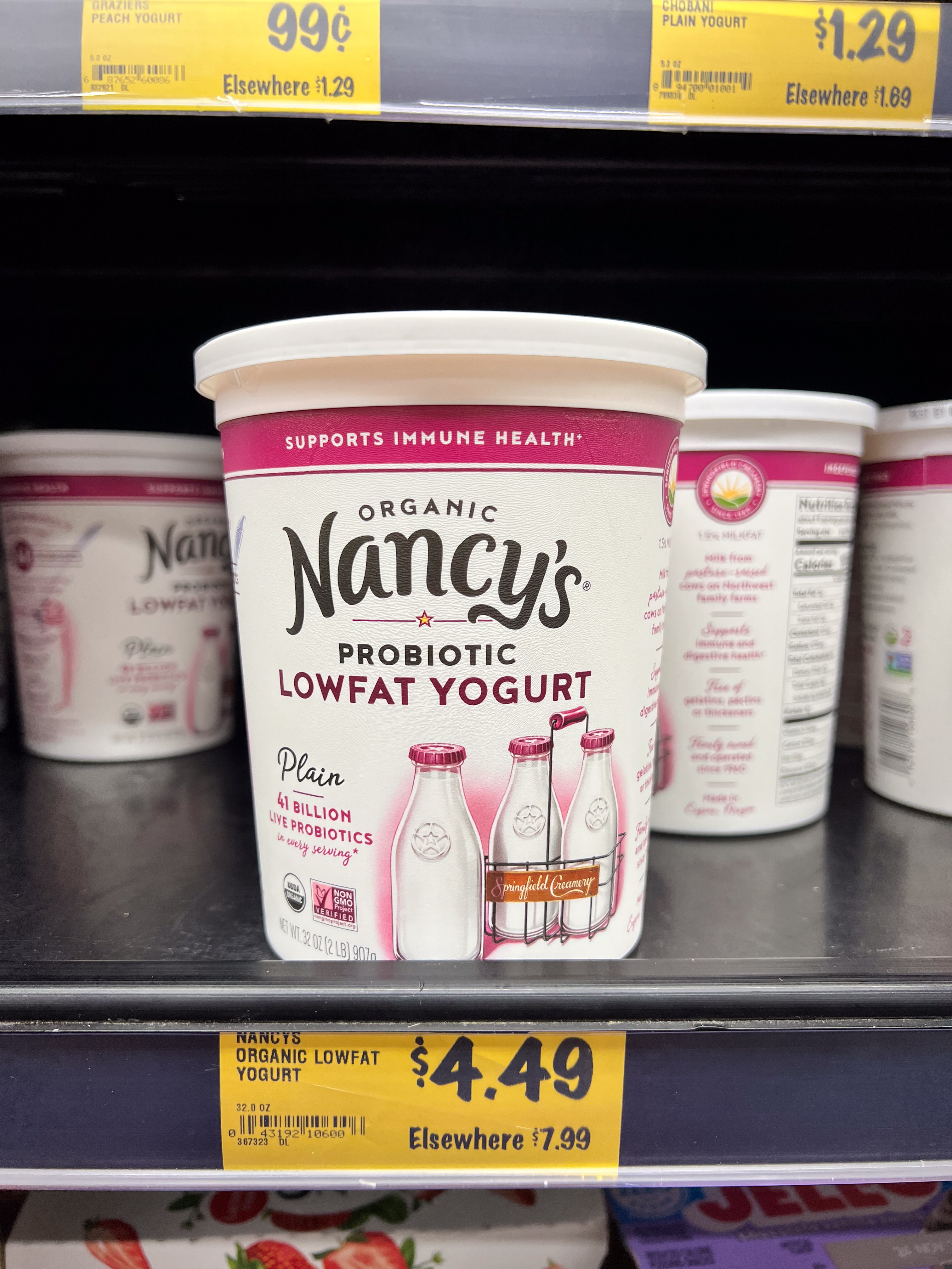Nancy's Organic Probiotic Lowfat Yogurt instrumentality connected a store shelf. Price tag reads $4.49, compared to $7.99 elsewhere