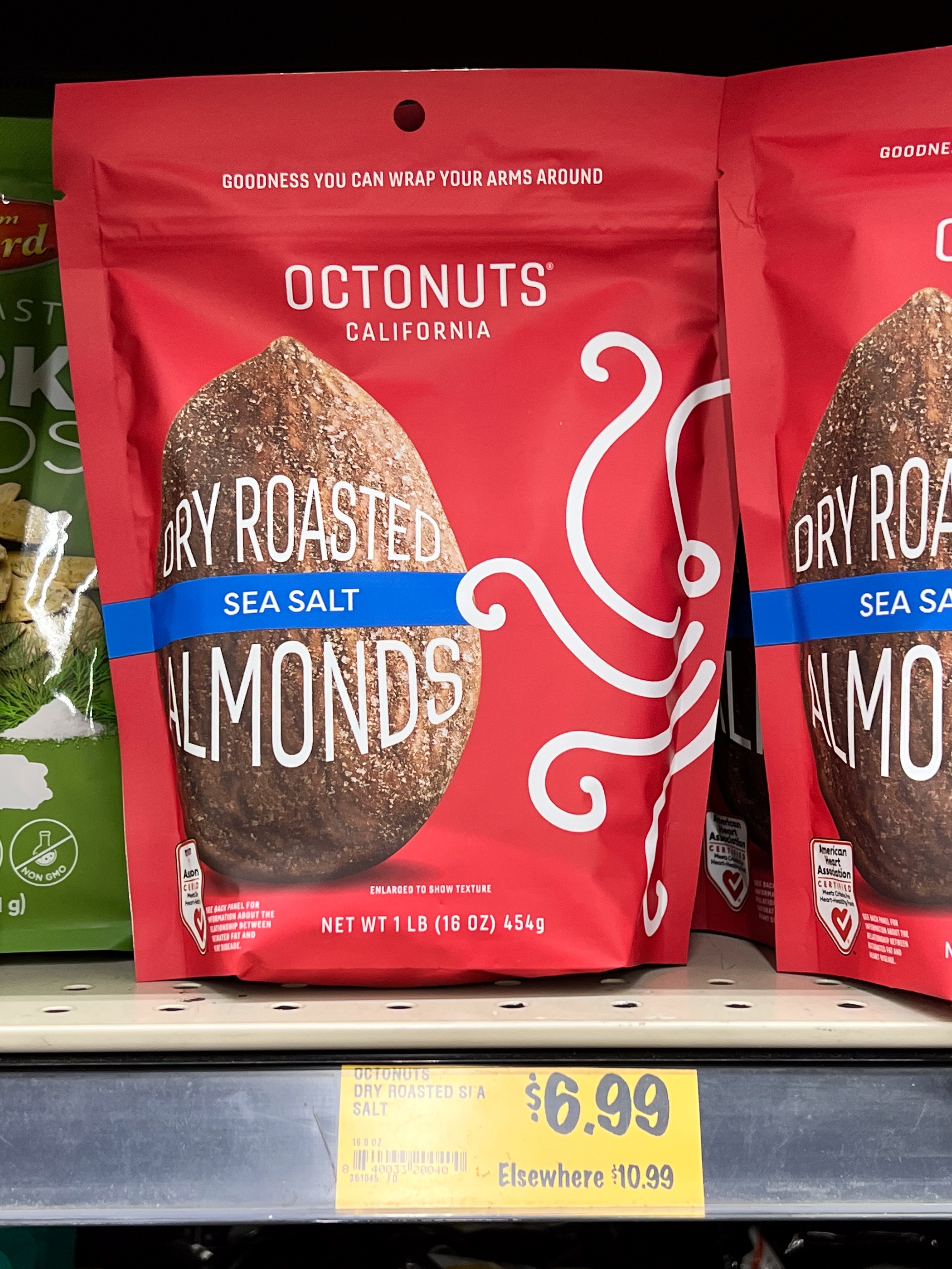 Package of Octonuts adust roasted oversea brackish almonds connected a store shelf, priced astatine $6.99