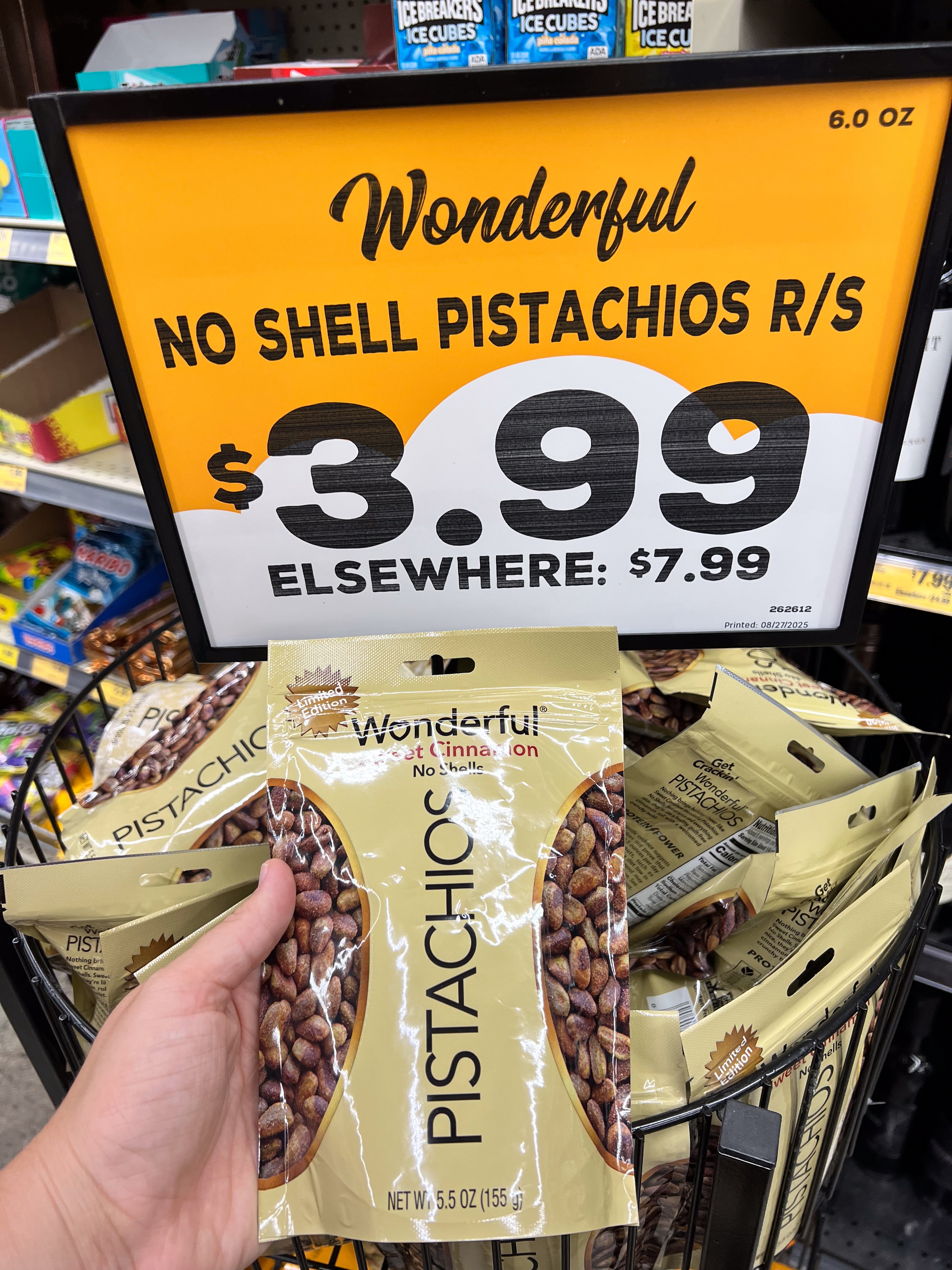 Pistachios connected merchantability for $3.99 astatine a store, regular terms $7.99. Display shows aggregate bags with a manus holding one