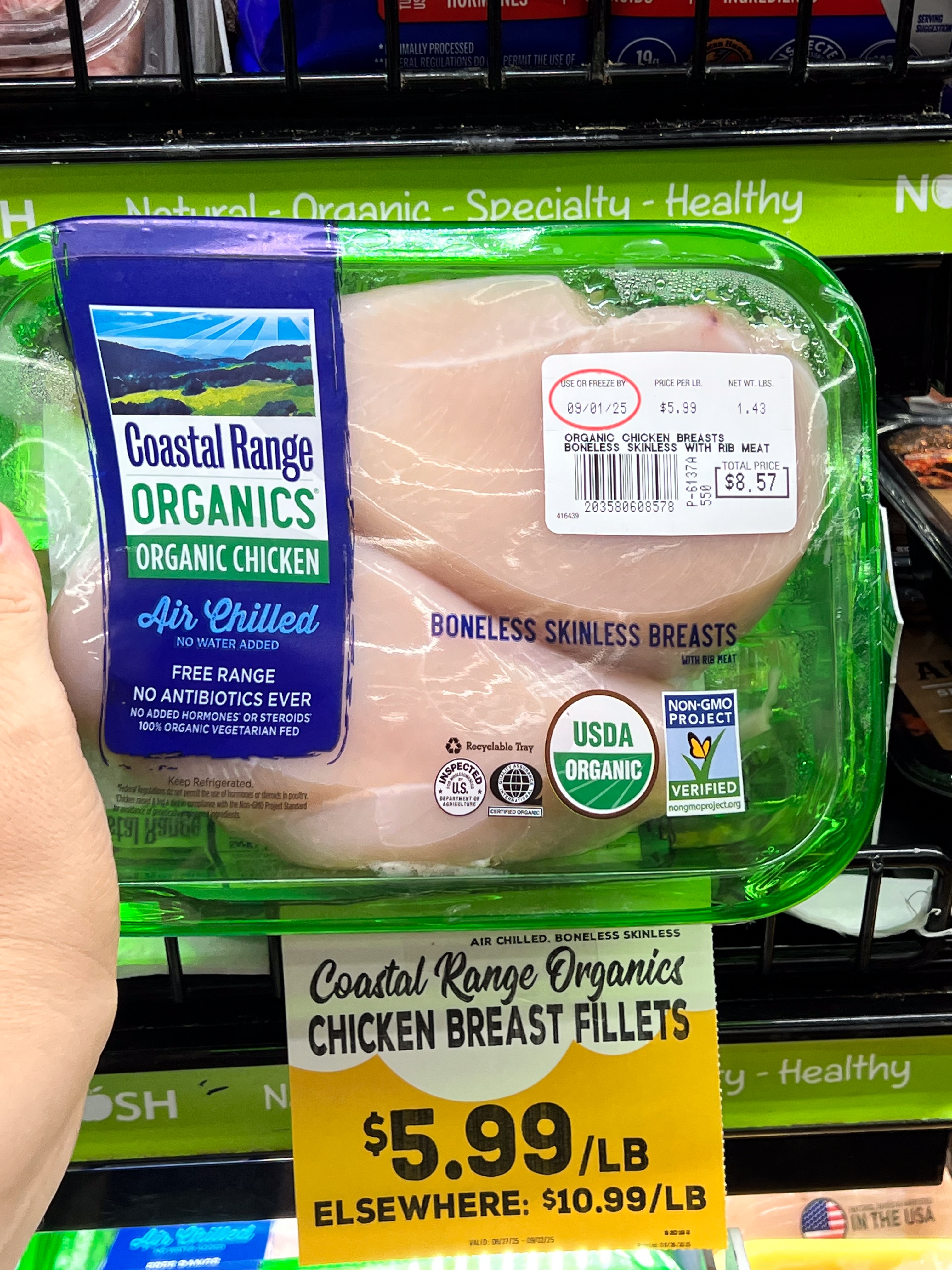 Package of Coastal Range Organics boneless skinless chickenhearted breasts, labeled arsenic organic, air-chilled, and non-GMO, priced astatine $5.99 per pound