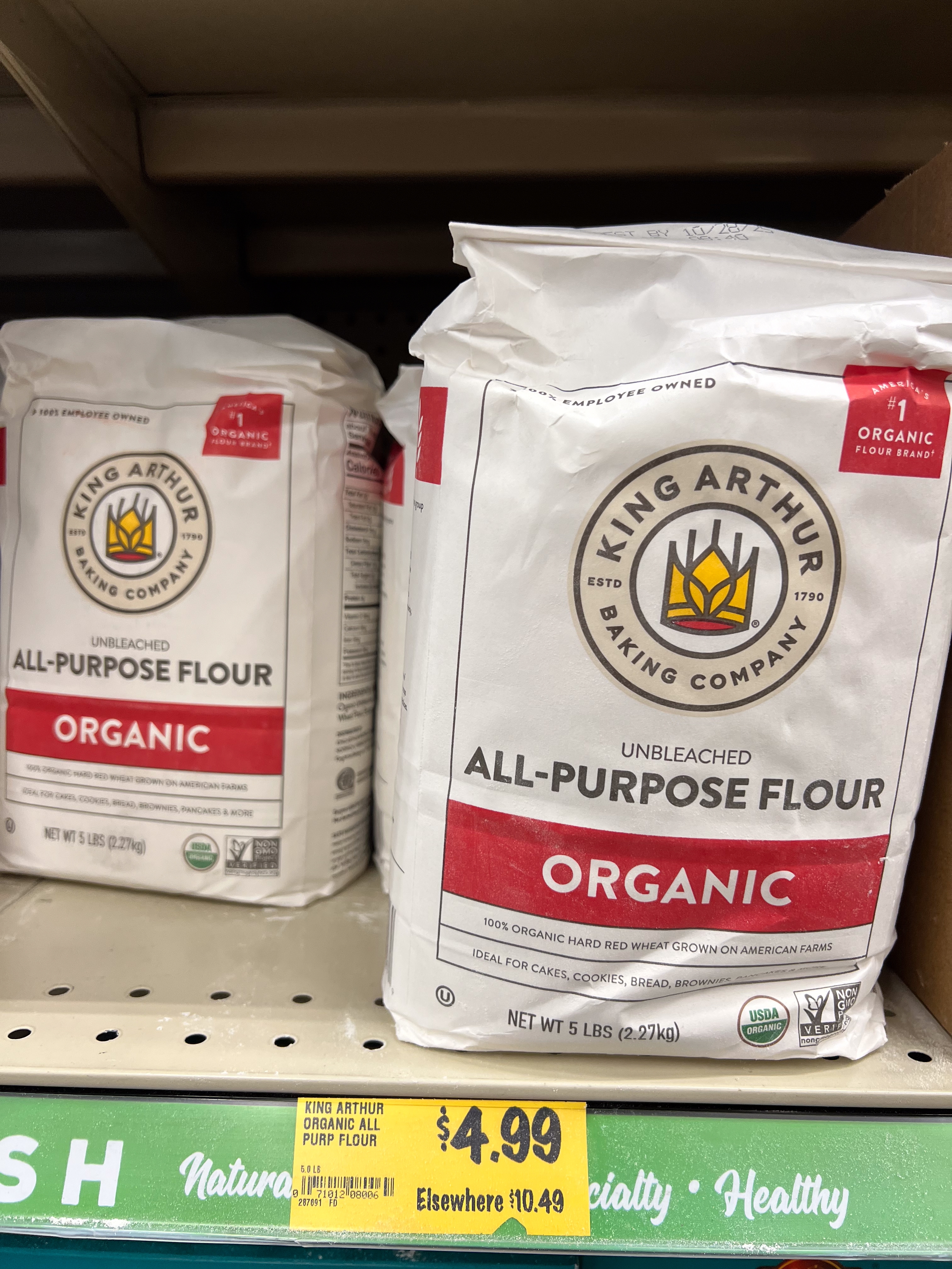King Arthur Organic Unbleached All-Purpose Flour, 5 lbs bags, priced astatine $4.99 connected a market shelf