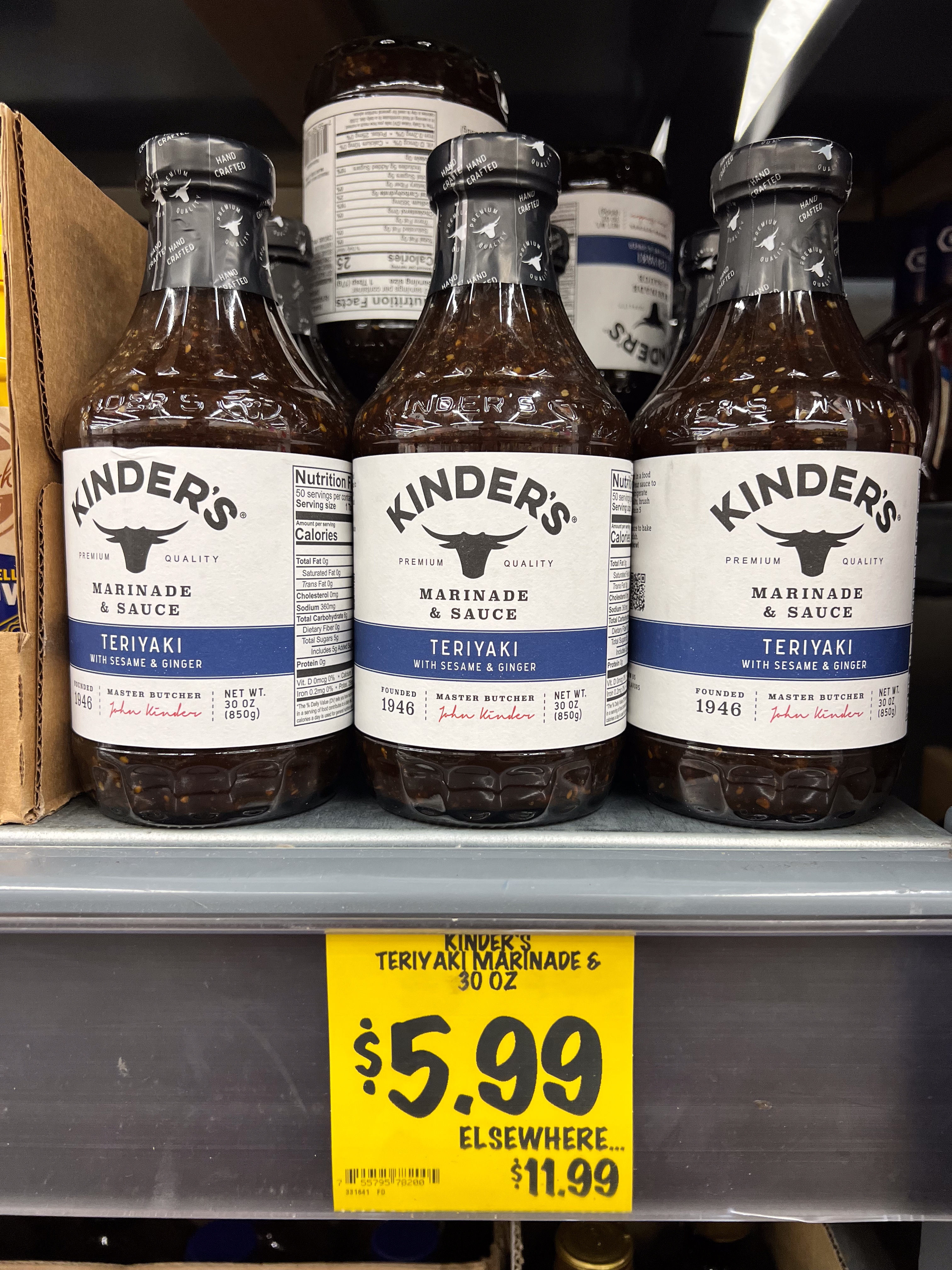 Three bottles of Kinders Teriyaki Marinade & Sauce connected a store support supra a $5.99 terms tag, noting a higher terms elsewhere