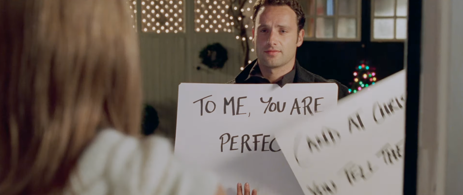 Person holding a motion   speechmaking  "To me, you are perfect" extracurricular  a window, portion  of a celebrated  movie   scene