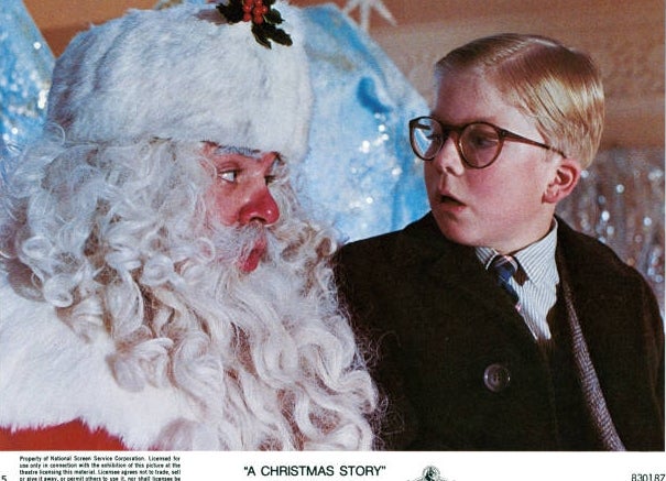 A kid  with glasses looks astatine  Santa successful  disbelief. The country   is from the movie   "A Christmas Story."