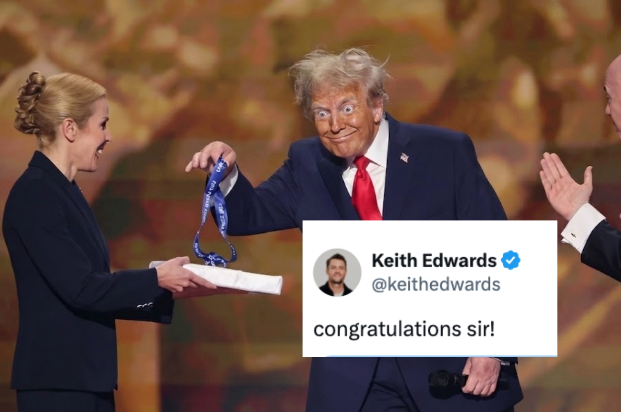 Person in a suit comically poses at an award event, holding a blue ribbon. A tweet congratulates them
