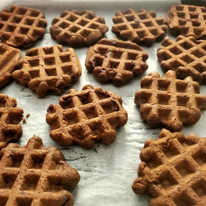 Waffle-pattern cookies arranged on a baking sheet, showcasing their crispy texture