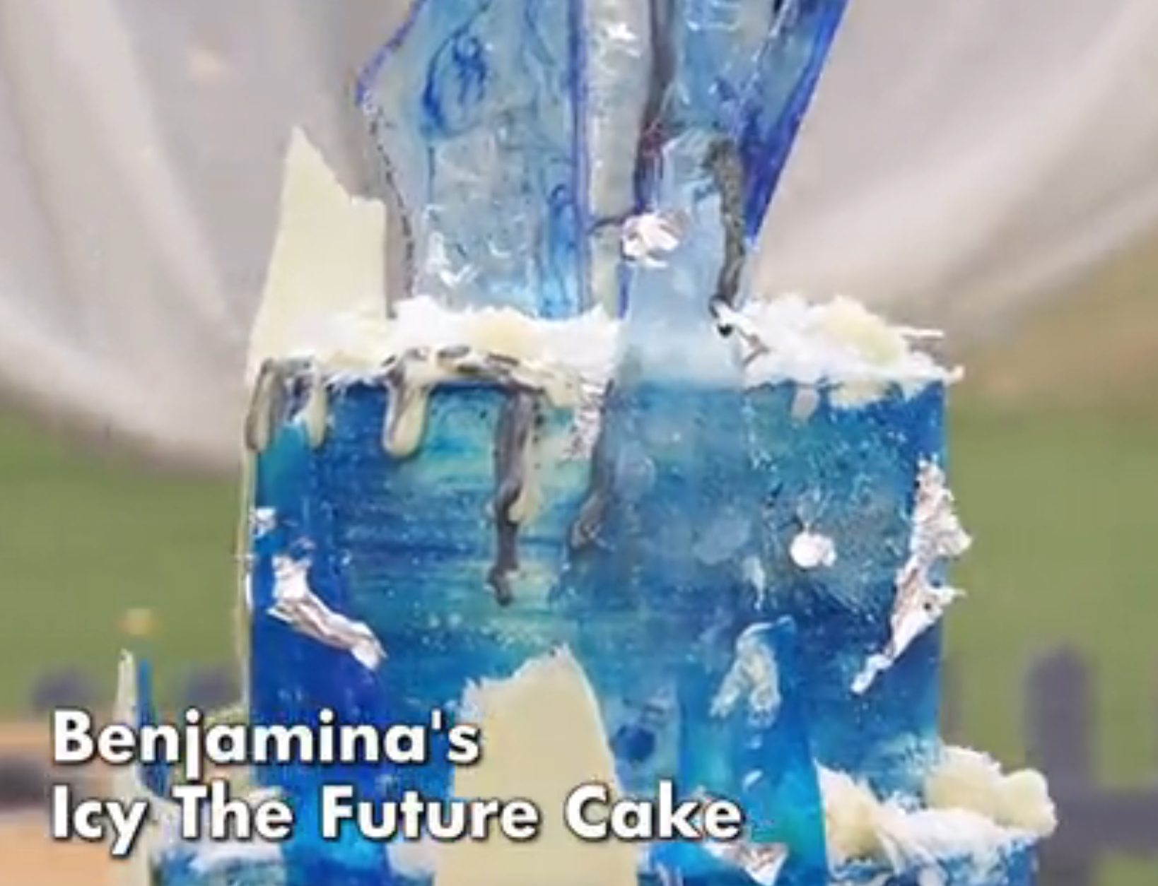 A tall, intricate cake with blue crystal-like sugar shards. Labeled: "Benjamina's Icy The Future Cake."