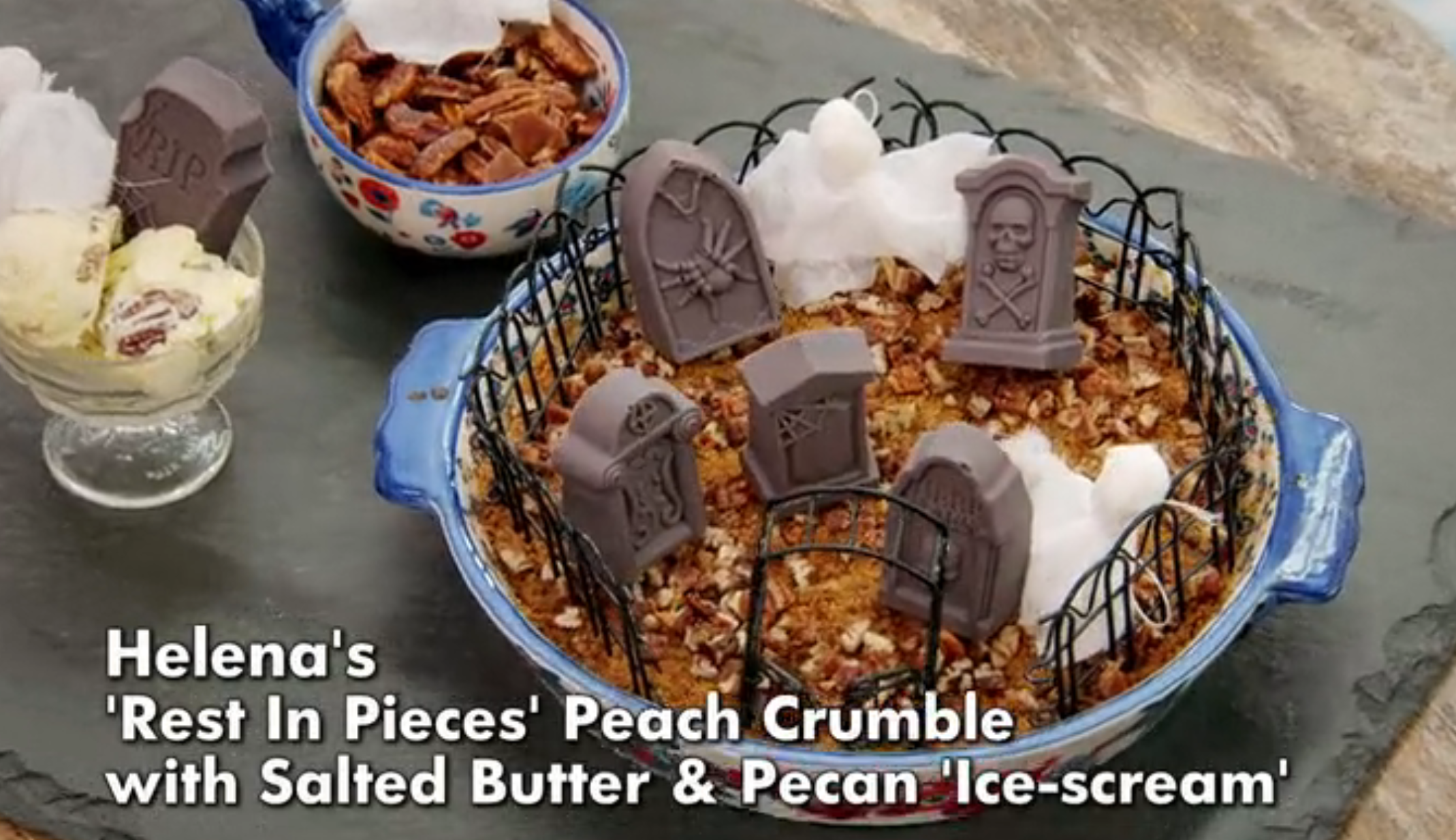 Halloween-themed peach crumble with chocolate gravestones, salted butter, and pecan ice cream served on the side