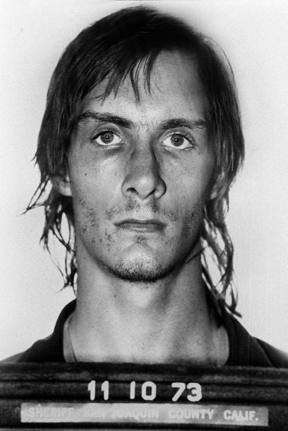 A black and white mugshot of an unidentified person with a serious expression, dated November 10, 1973, San Joaquin County