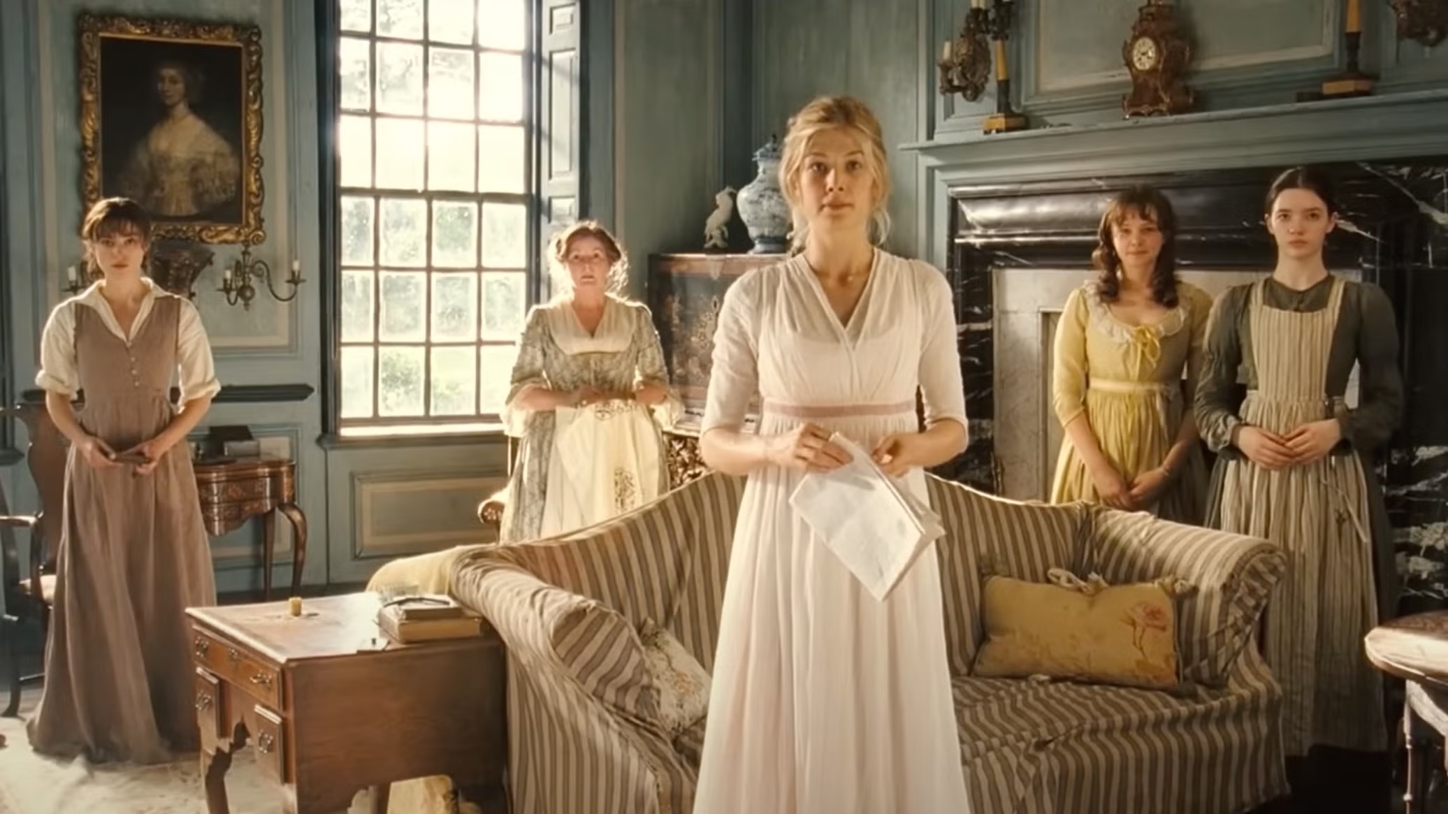 Five women successful  play  dresses basal   successful  an elegant, historical  country   with a ample  model   and antique furnishings