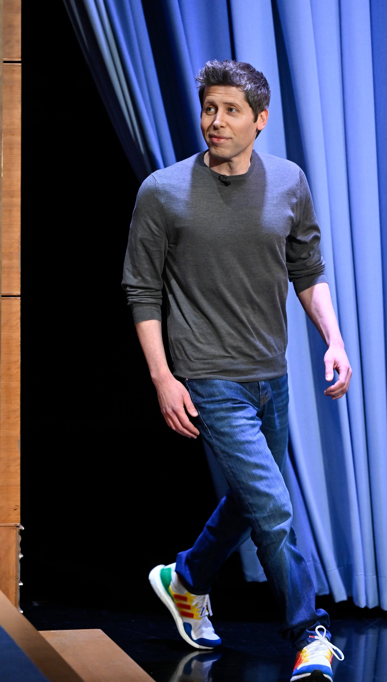 Sam Altman walking on stage