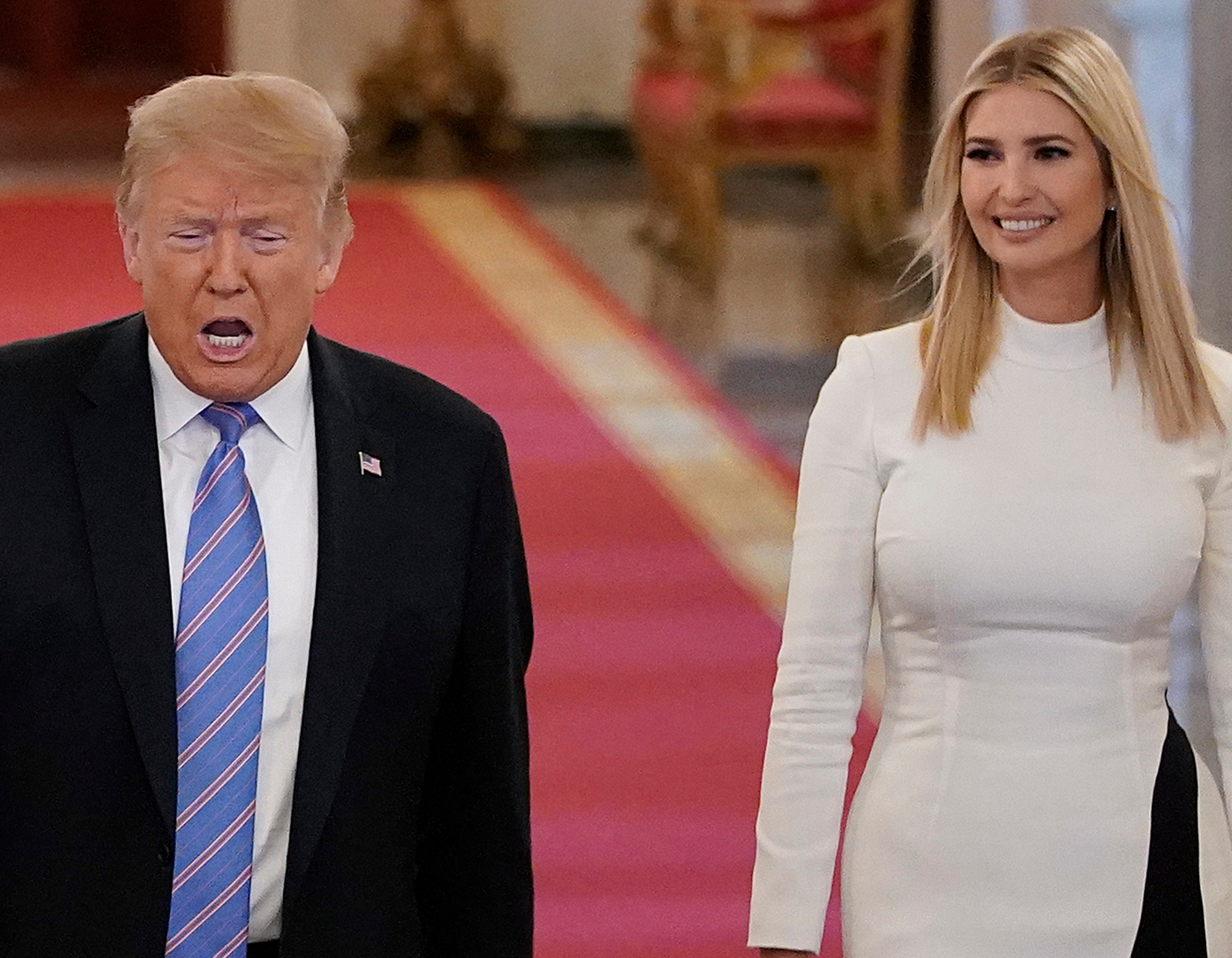 Two radical   walking indoors, 1  successful  a achromatic  suit   with a striped tie, the different   successful  a long-sleeved formal  with achromatic  and achromatic  panels