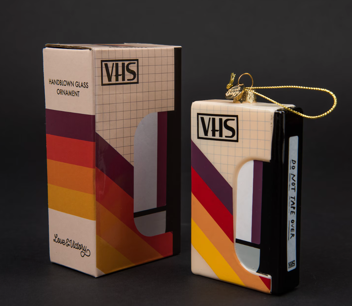 VHS ornament with retro plan  adjacent  to its packaging. Ideal for nostalgic location  décor oregon  vacation  gifting