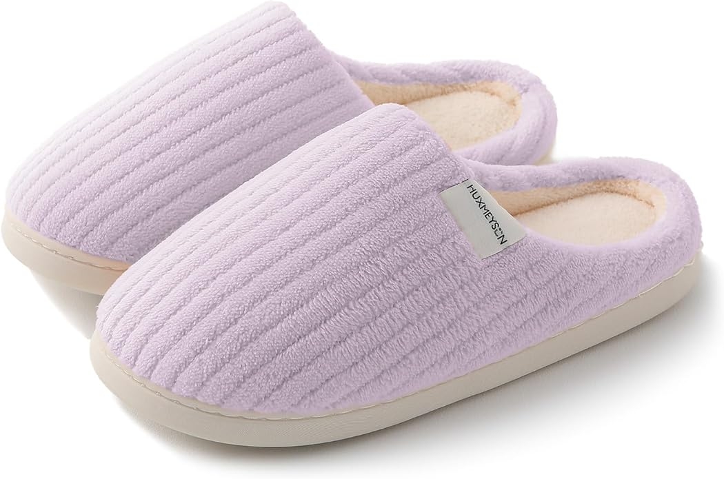 Cozy ribbed slippers with a brushed  texture and cushioned sole, suitable for location  comfort