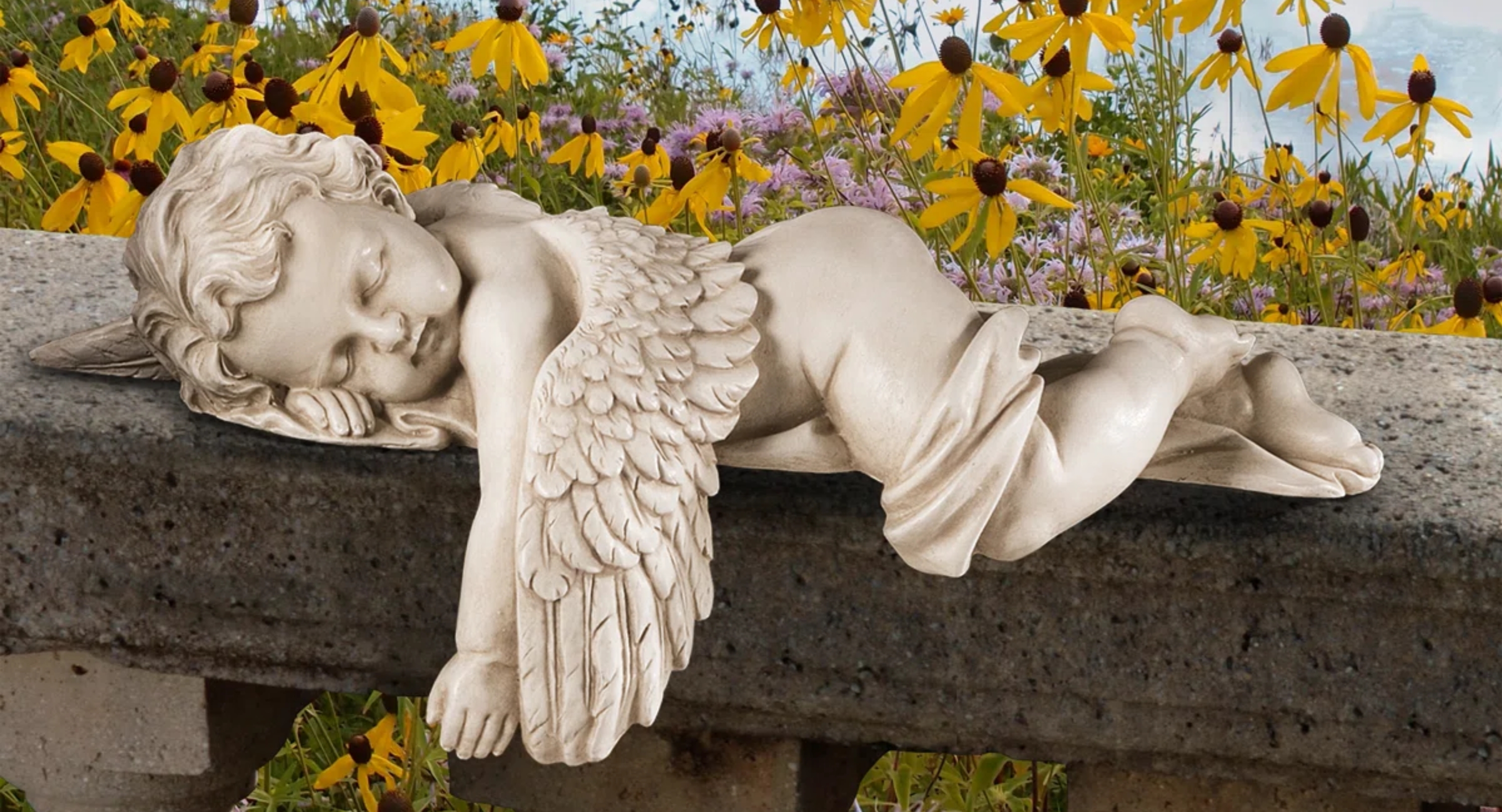 Sleeping angel statue with wings rests connected  a chromatic  ledge, surrounded by blooming wildflowers successful  the background