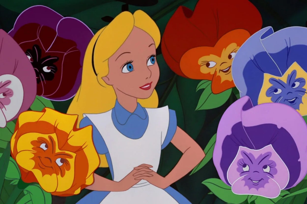 Animated character with a blue dress surrounded by large, smiling talking flowers with expressive faces
