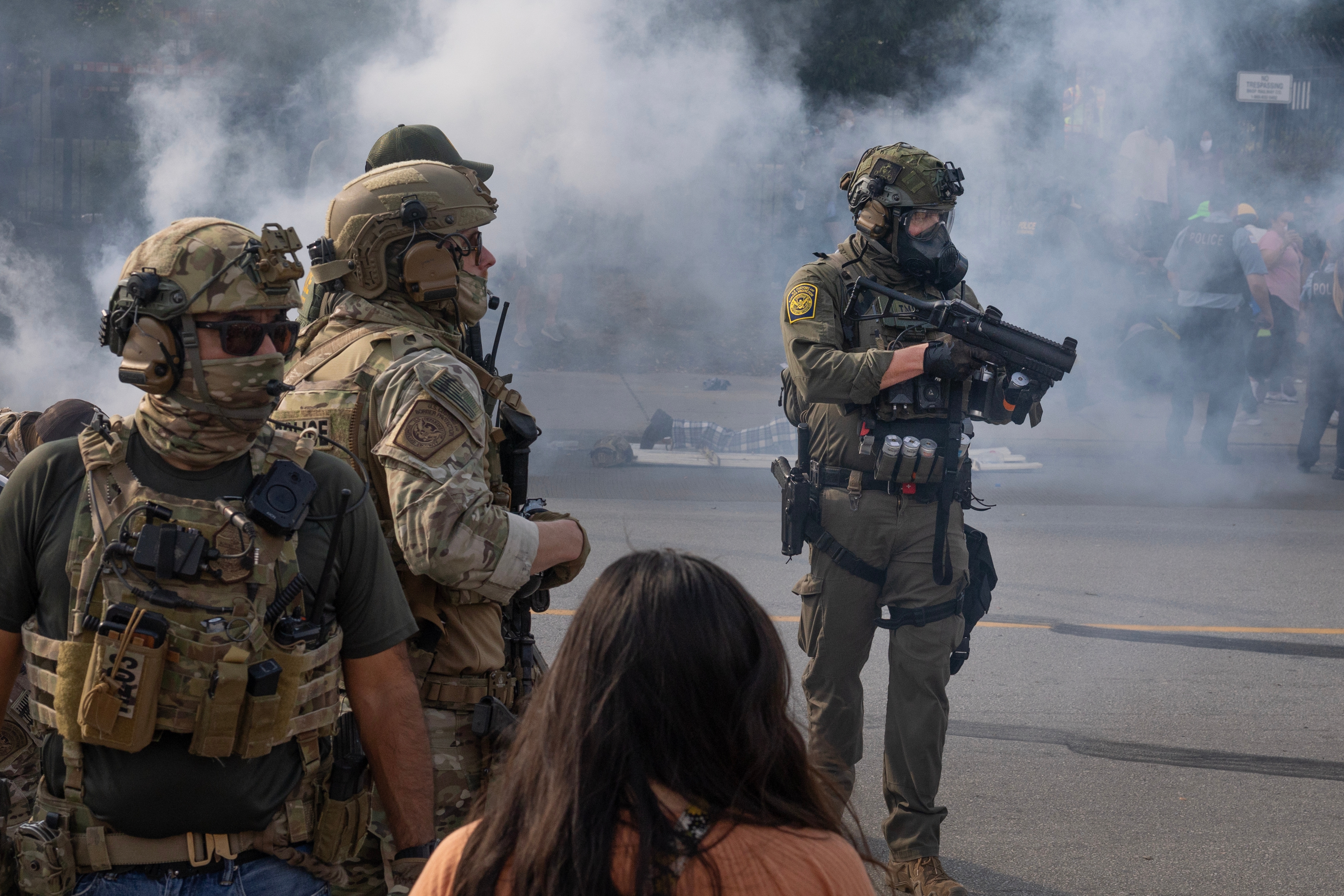Law enforcement officers successful tactical cogwheel basal amidst fume connected a street, facing a assemblage during a protestation oregon intervention