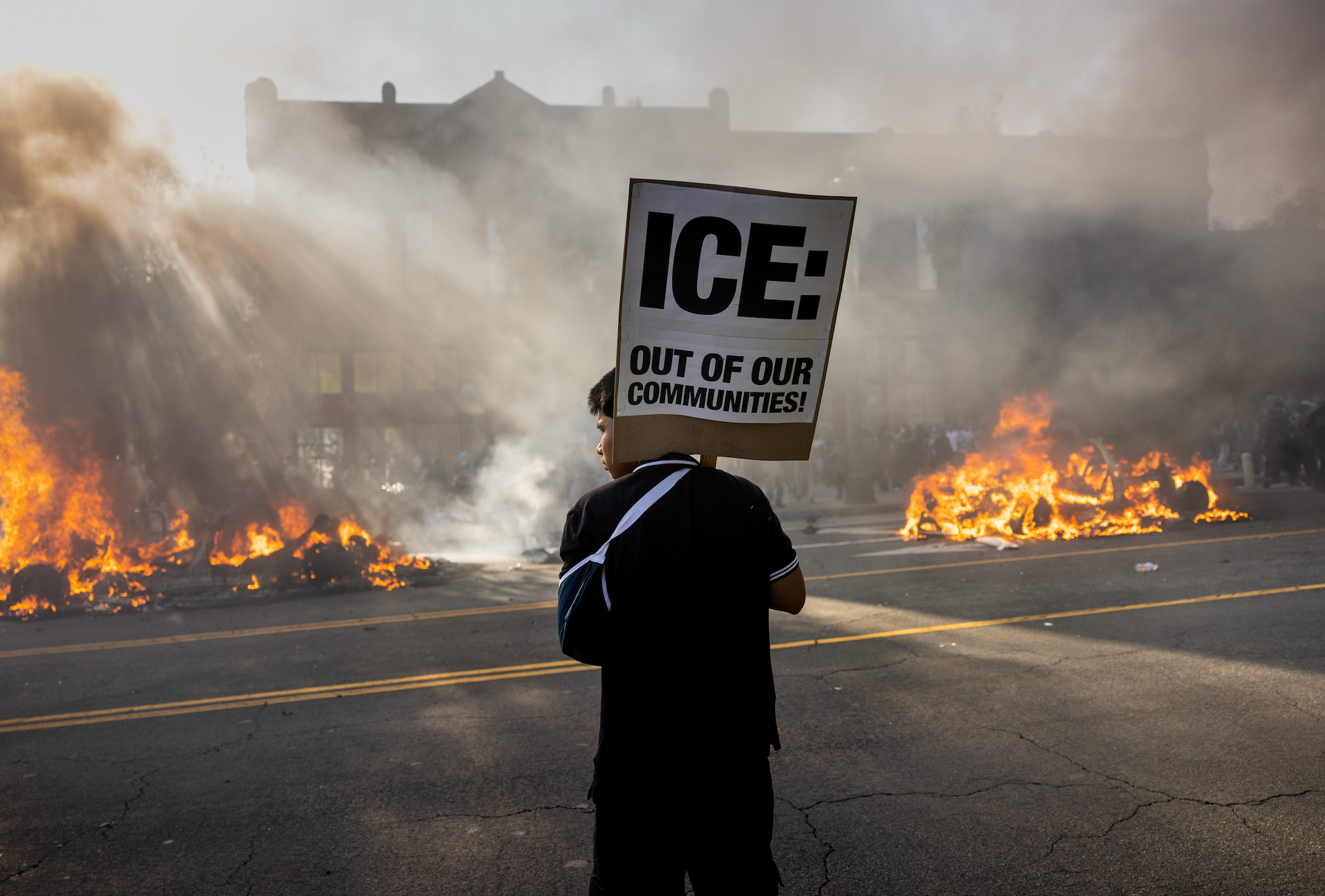 Out of Our Communities!" stands successful beforehand of thoroughfare fires during a protest