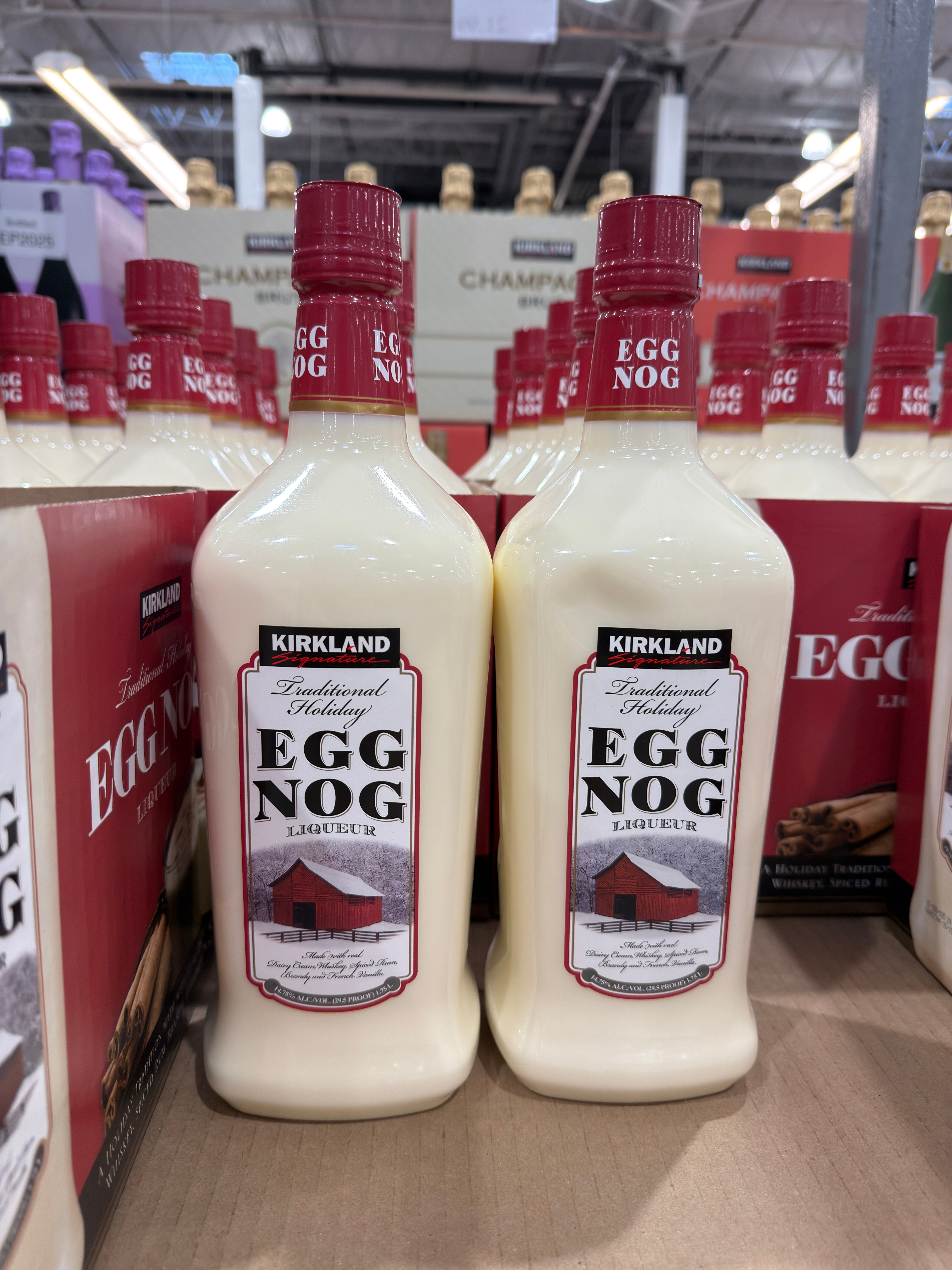 Bottles of Kirkland brand egg nog liqueur are displayed on a store shelf
