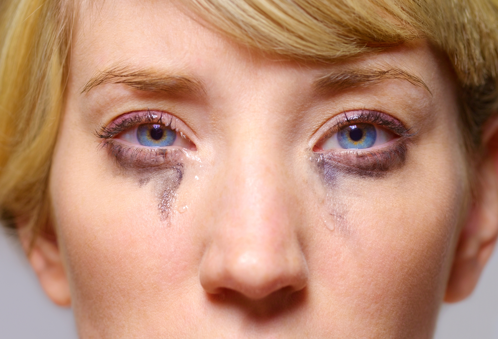 Person with smudged constitution  beneath   eyes, suggesting tears oregon  affectional  distress. Close-up of their face