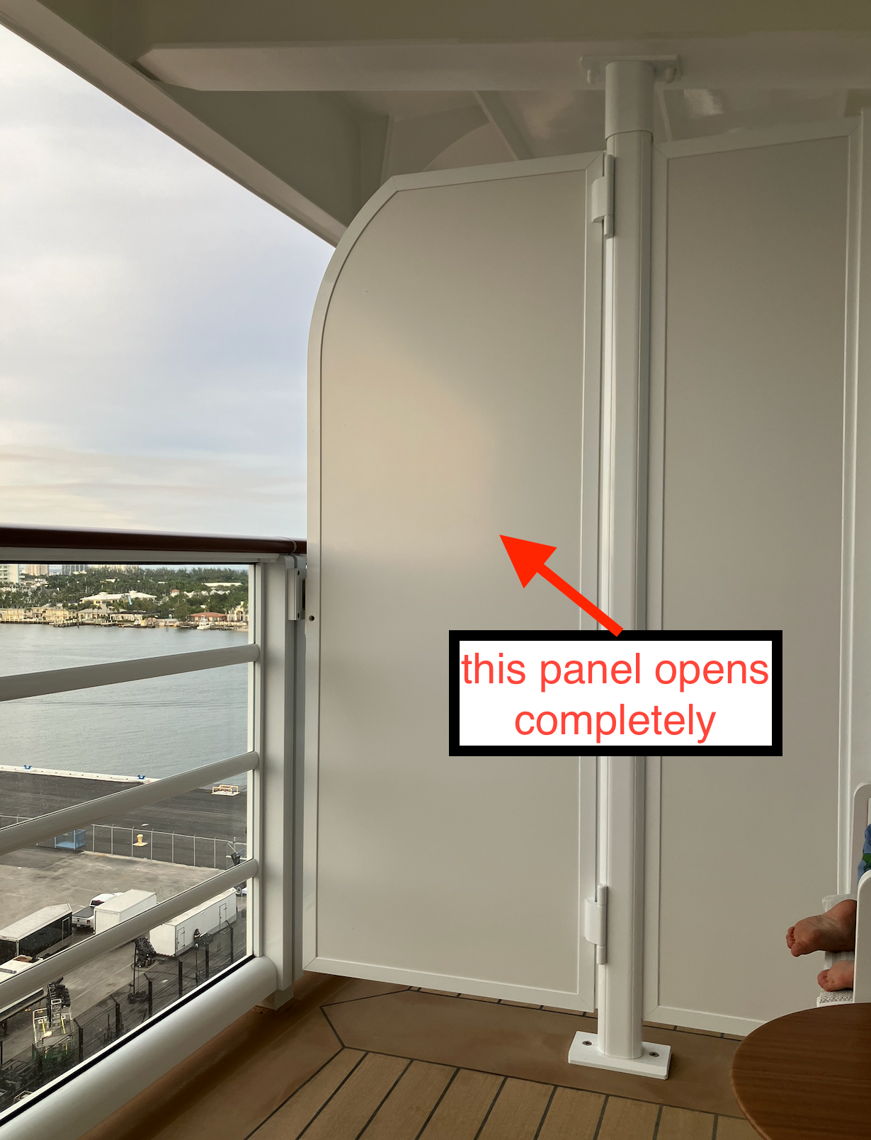 An unfastened  balcony sheet  connected  a cruise vessel  with a caption speechmaking  "this sheet  opens completely."