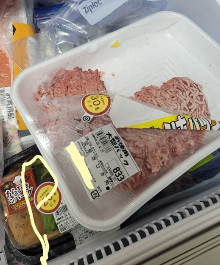 Partially unfastened bundle of crushed nutrient successful a freezer drawer with assorted frozen items, including Ziploc bags and different nutrient packages