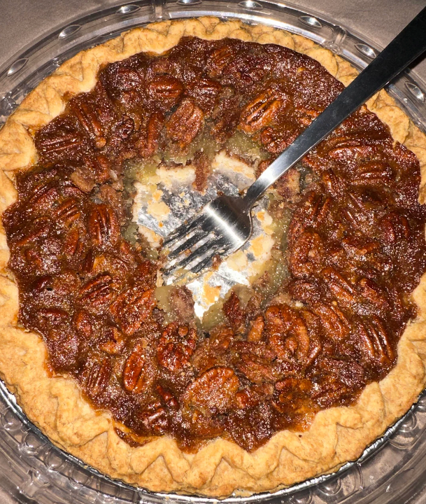 Pecan pastry being eaten consecutive from the middle